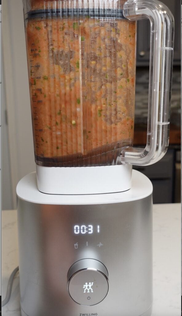 Salsa ingredients blending in a blender